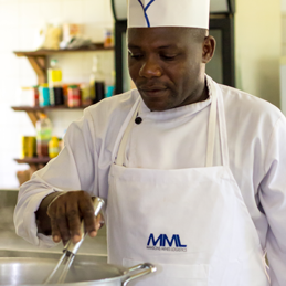 Picture of a chef stirring food.